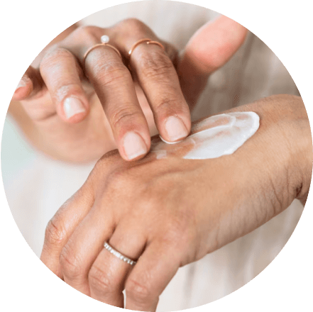 Applying cream to hand